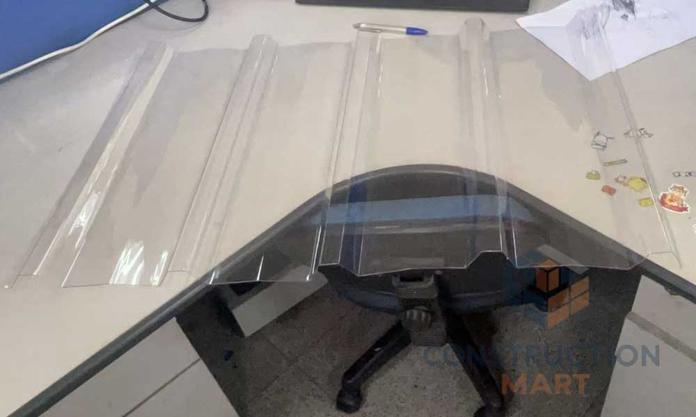 Constructionmart polycarbonate 5-rib corrugated sheet applied in architectural structures, showcasing pentagon wave design and light diffusion.