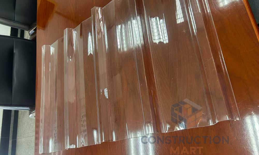 Constructionmart polycarbonate 5-rib corrugated roofing used in modern industrial buildings for durable and translucent covering.