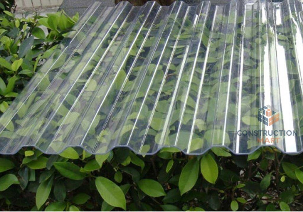 Transparent Constructionmart 840 polycarbonate corrugated sheet placed above green plants, showing its clear texture and excellent light transmission.