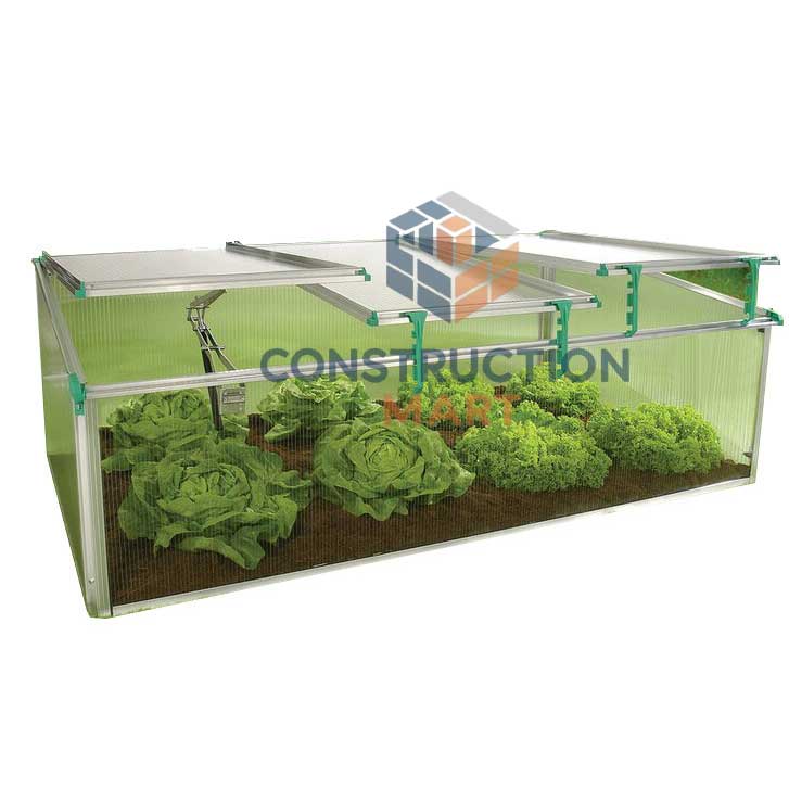 Polycarbonate greenhouse with vegetable garden inside, built with durable Constructionmart panels offering optimal light diffusion and insulation for plant growth.